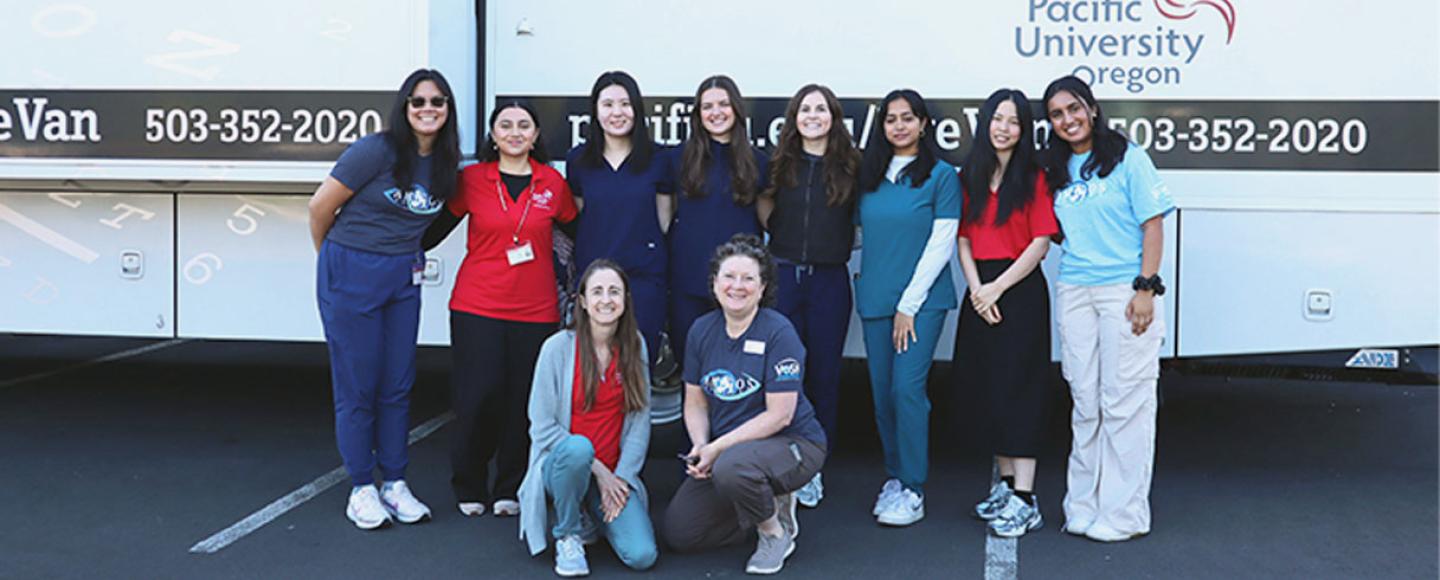 A group of 10 Pacific University College of Optometry students smile for the camera