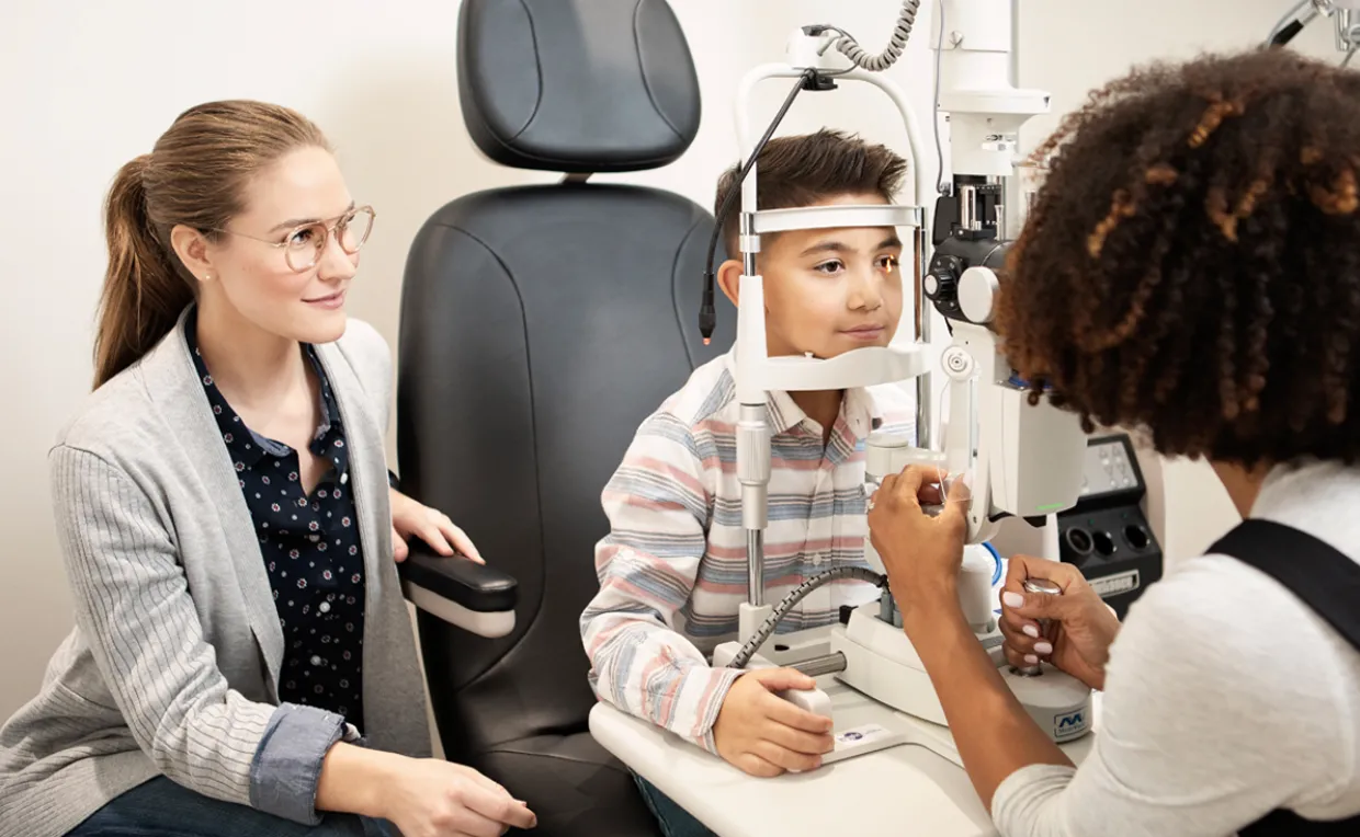 Optometrist Examining Young Patient