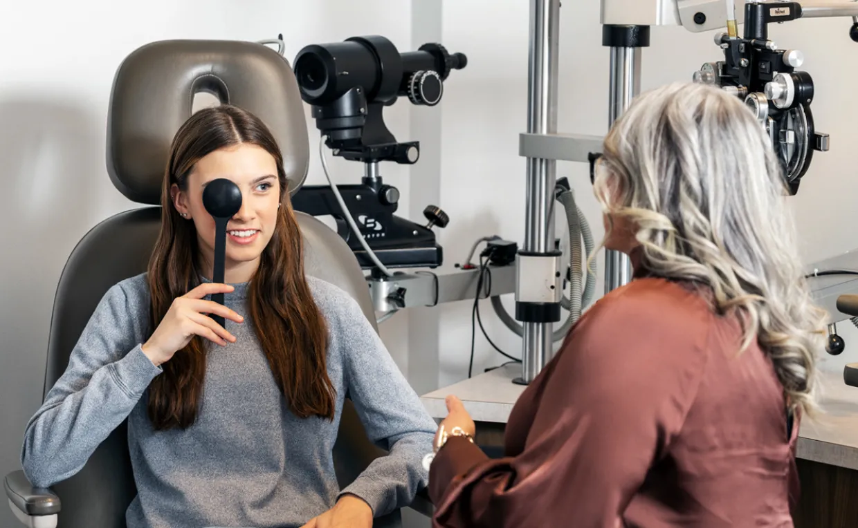 Optometrist Examining Young Patient